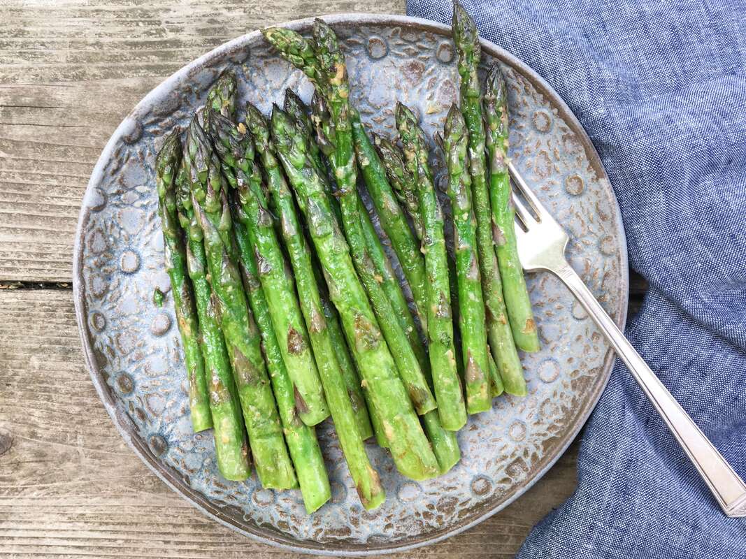 Roasted Miso asparagus on a nice plate outside in the sun
