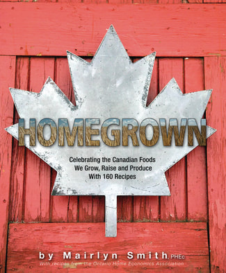 Red cookbook with silver maple leaf on cover titled Homegrown