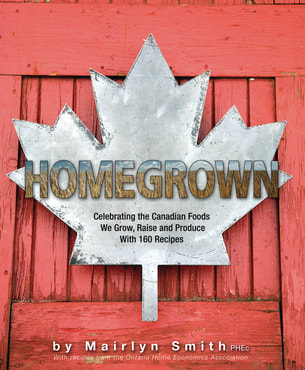 Image of red cookbook with a silver maple leaf titled Homegrown
